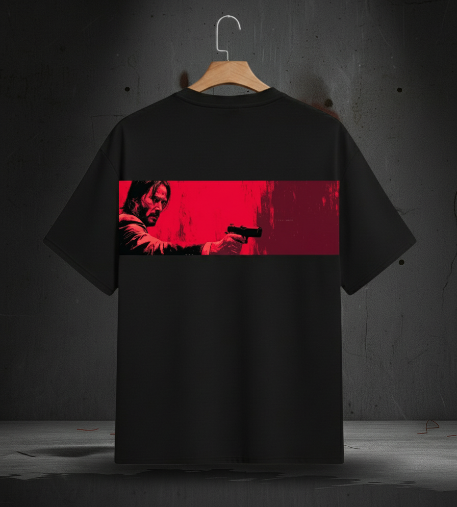 Black t-shirt with a graphic design on a hanger against a dark background